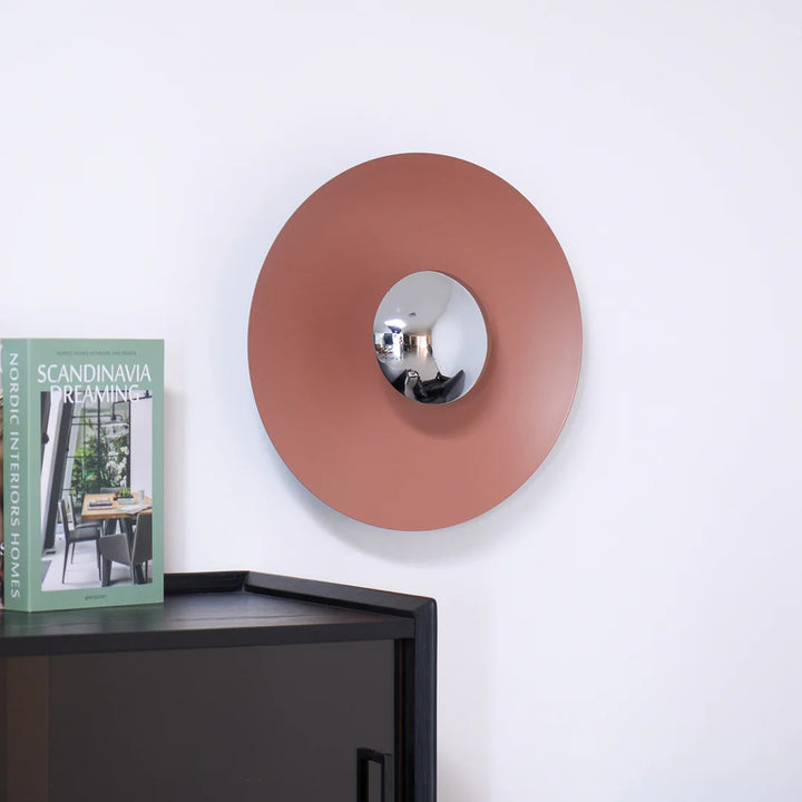 Round wall mirror with metallic finish 